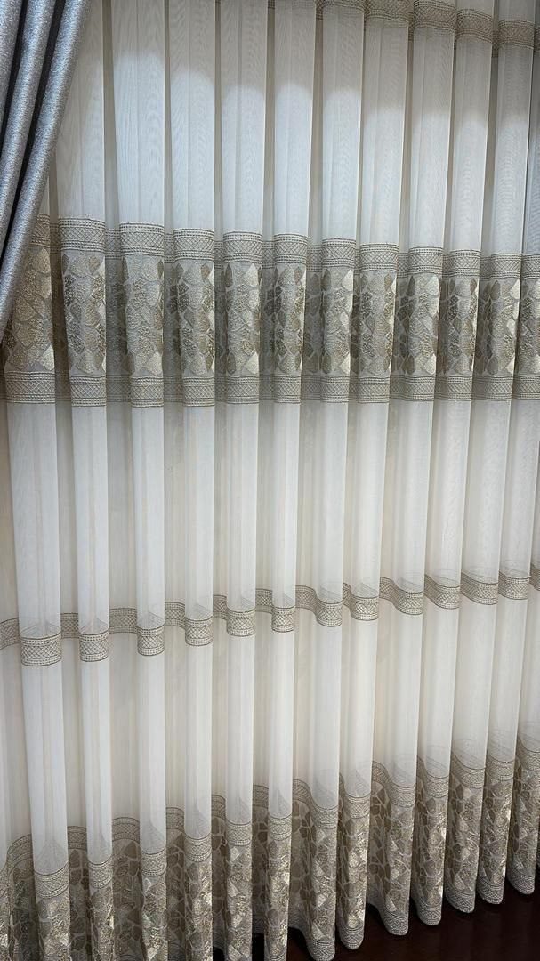 Curtain fabric detail, embroidered band