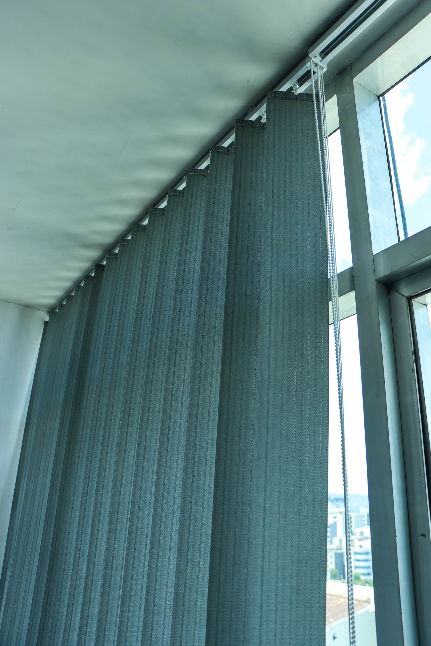 Floor-to-ceiling vertical blinds installed in a modern Addis Ababa office