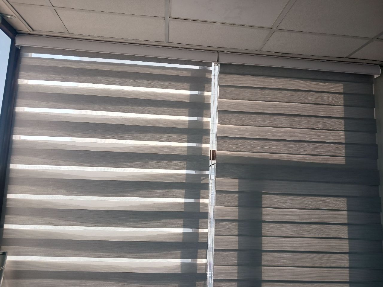 Zebra blinds, wood-grain finish
