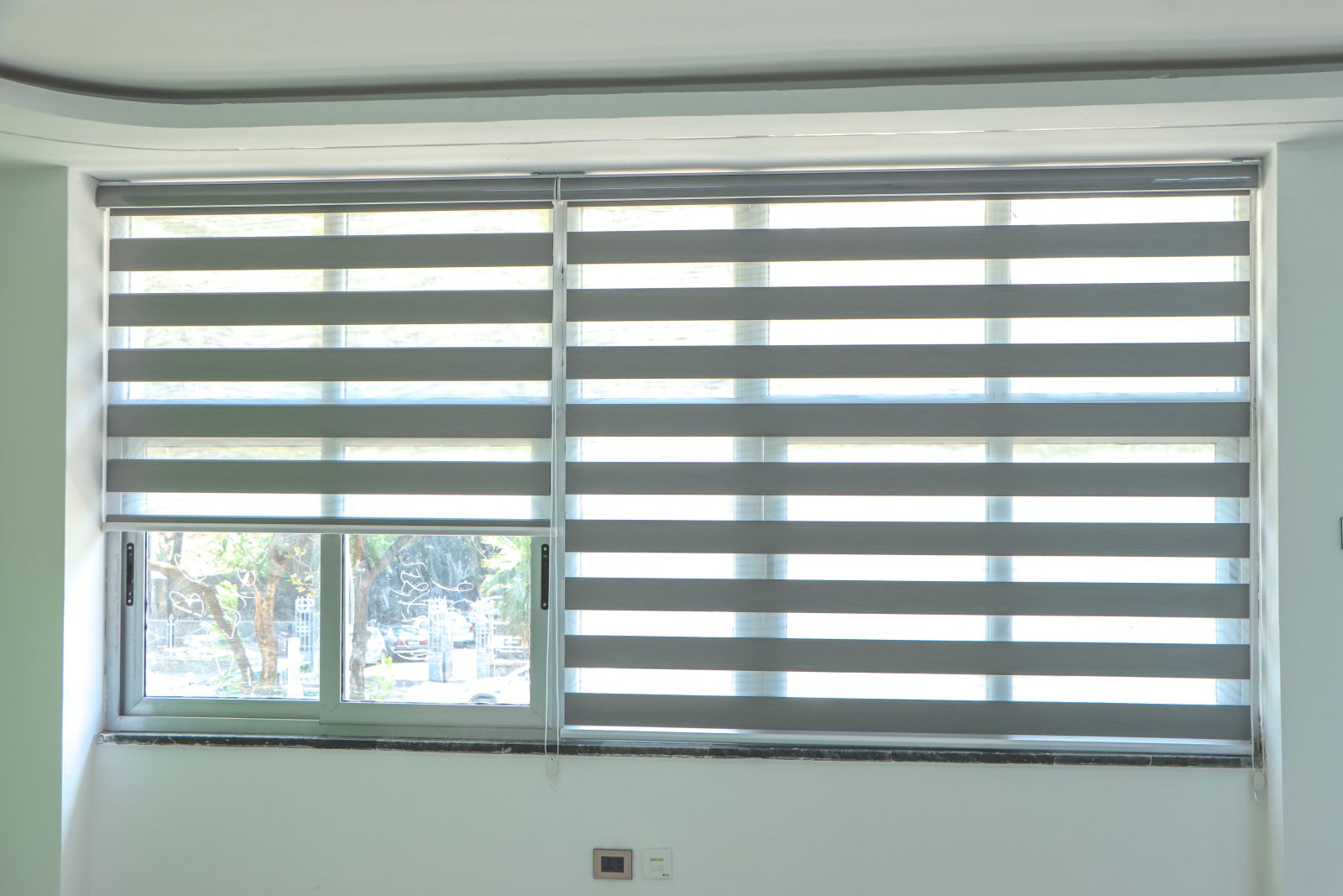 Zebra blinds, garden-facing window